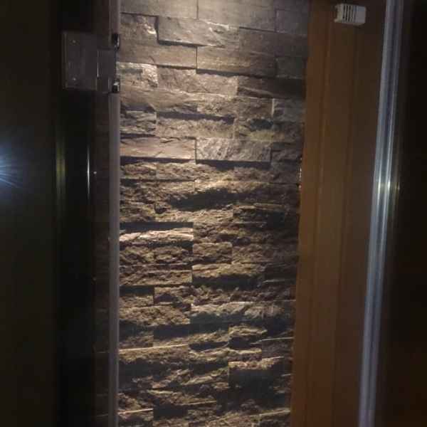 отделка сауны камнем и установка печи